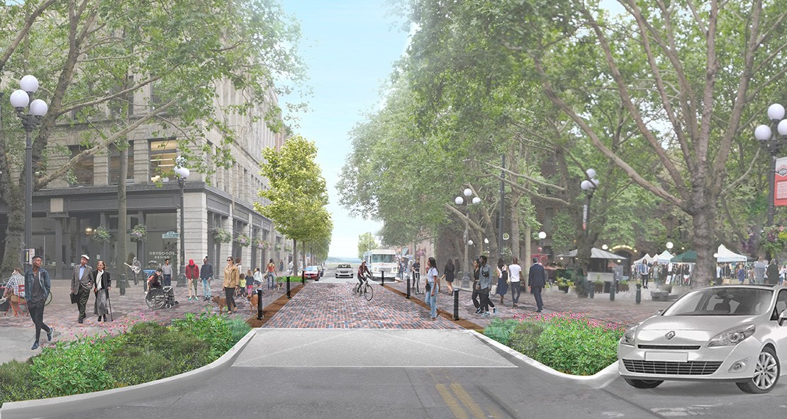 Design rendering showing people in Occidental Park crossing Main Street at an intersection that is raised a few inches above the street to encourage cars to prioritize pedestrians, with trees and greenery around.
