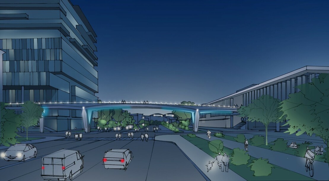 A rendering of vehicles driving under a pedestrian bridge that is lit up at night.