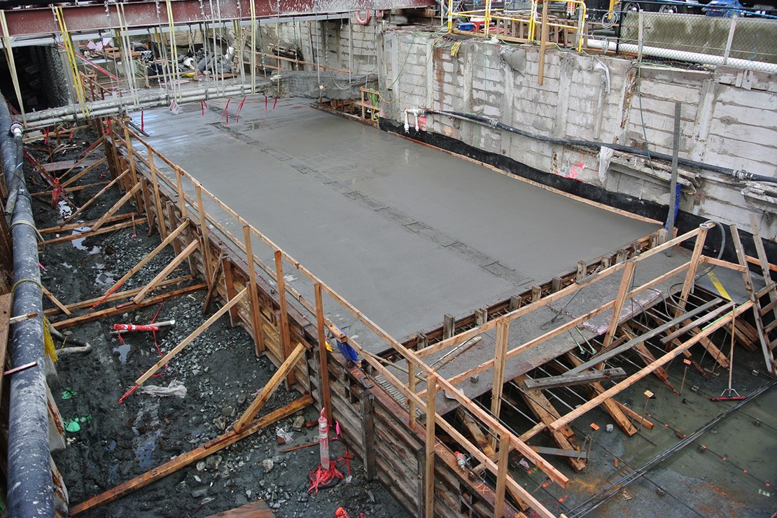 Photo of a poured concrete slab curing.